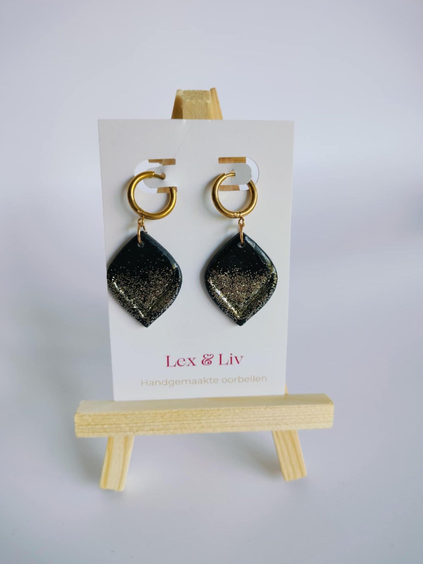 Zwarte druppels met glitter