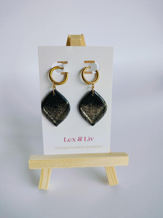 Zwarte druppels met glitter